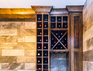 Basement remodel with kitchen, wetbar, bathroom, living area and bedrooms This basement was completely unfinished. The homeowner had us add a kitchen, 