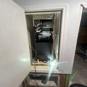 Unit being tidied up. Air Handler in Cabinet.