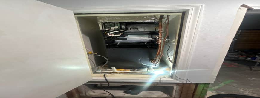 Unit being tidied up. Air Handler in Cabinet.