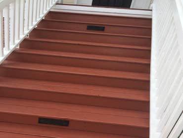 Daniel Island Porch Updated floor of porch to a crimson color to reduce visibility of dirt and debris. Material applied was also a sealant and long ter