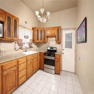 Kitchen Remodel In Los Angeles Ca White Shaker Cabinets & Panda Quartz Countertop