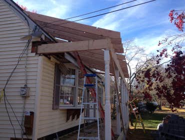 Maple Ave. Remodel of house outside and inside.
New front porch with small bump out on left side of front of house. Also with a 15'x25' addition on le
