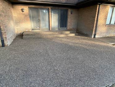 Photos by Guevara Alexander #1 A curated collection of our high-end residential concrete work, including stamped patios, exposed aggregate driveways, w