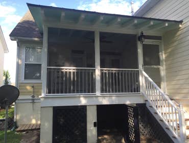 Rivertowne Screen Porch Addition Added a screened in porch off of existing home with custom wood grain tile, screen, pickets and electrical details.