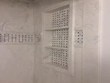 Photos by North Alabama Remodeling Co. LLC #2 Cultured marble showers with tile feature inlays in custom designed bathroom remodels
