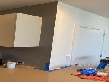Corner of kitchen. Drywall and stone corner.