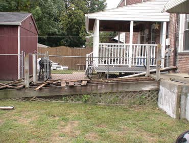 Handicap Ramp Project required the removal of an existing ramp and railing which than was replaced with the construction of a new ramp and railing. Als