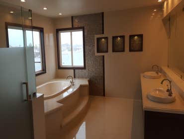 Bathroom Remodeling This homeowner wanted to update their bathroom with a stunning wood and glass feature wall and open-plan design. We installed a Jac