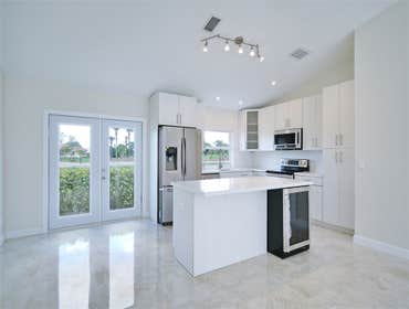 Mykonos Remodel Complete remodel from A-Z. New kitchen, baths, flooring, top to bottom. Gorgeous, minimalist.