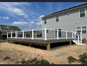 Photos by Pristine Construction #12 Removed a 30 X 30 concrete pad and replaced with a 30 X 30 Trex deck with stairs on both sides