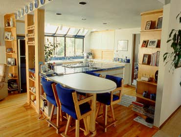 1987: Garden View Eat-In Kitchen In this small greenhouse addition we captured a second floor porch surrounded by the U-shaped second story of the home