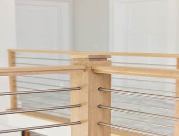 Photos by San Clemente Woodworking #1 Stainless Steel horizontal rods with our custom shadow posts. Clean lines and modern design.