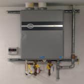 Tank less WH Tank less Water Heater customer provided (explains the dent)