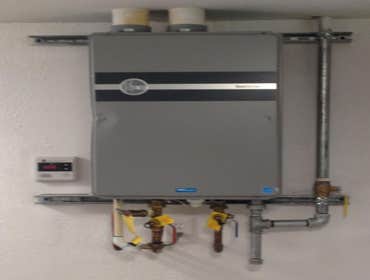 Tank less WH Tank less Water Heater customer provided (explains the dent)