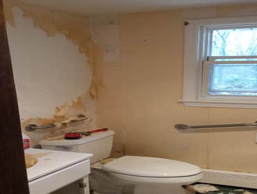 Small bathroom in Attleboro Ma We removed wall paper, patched and fixed walls. Fixed cracks on the ceiling, textured ceiling. Changed vanity, and van