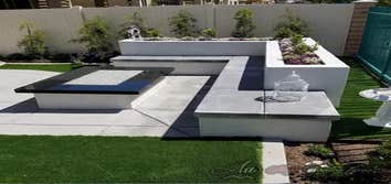 Outdoor living space, planters, fire pit, turf, stamped Concrete