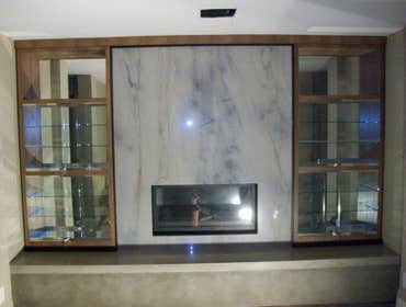 Modern Media Center in Woodland, Hills, California Woodworking OC built this custom zebra wood entertainment center and rift oak media center at this 