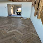 Photos by Ot Flooring Inc #1 Custom herringbone hardwood floor installation with a clean, seamless layout. Precision cuts and detailed craftsmanship cr