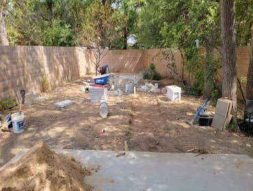 Black star gravel & charcoal leuder pathway firepit with seating area in Austin TX
