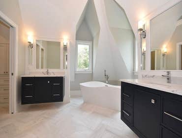 Luxury Custome Home This custom-built home in Illinois is completed with beautiful spiral staircases, wood finishes, gorgeous light fixtures, and a wal