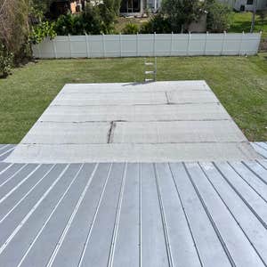 Photos by Triple Crown Roofing and Repairs Corporation #7 White granulated flat reroof.