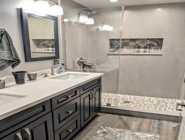 Bathroom Remodeling in Orange we completely remodeled the bathroom, including a new walk-in shower with shampoo nitches, frameless shower door, granite
