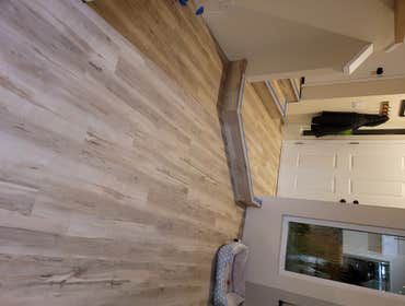 Photos by Carpet & Flooring Investors Inc living room kitchen bathroom and stairs