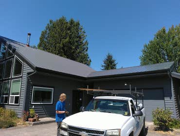 Photos by Zack of All Trades LLC #6 Strip and replace existing comp roof with custom steel roof. Replace and re frame sheeting and trim boards on top o