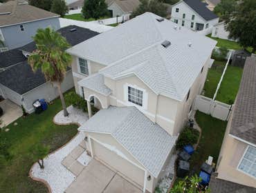 Photos by WOODSTONE ROOFING