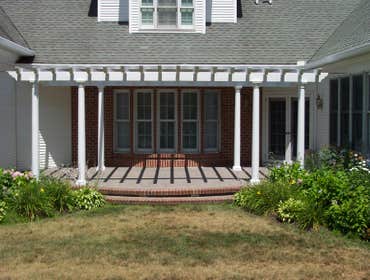 (2) Custom designed timber-framed pergola, timber-framed carport Each timber is hand carved to fit into the joining beam.