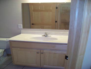 Finished Basement Finished a basement, framing, sheetrock, bathroom tile, bathroom vanity, ceiling tile, trim, doors and hardware.