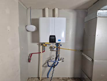 Photos by Drain Masheeen plumbing LLC #1 Tankless water heater full installation, bathroom remodel