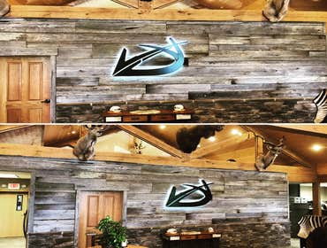 Commercial Entryway & Lobby Upfit Entryway columns and yard signage were custom built and installed. The stonework, wood structure, and metalwork are 