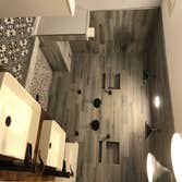 Photos by Elite Building and Remodeling #1 Rustic Bathroom