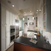 Colonial Kitchen Remodel - Saratoga, CA This full Colonial style kitchen remodel in Saratoga, CA featured: White cabinetry - A farm house sink - Wolf d