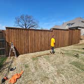 Photos by Keller Fence Contractors #1 Prestain cedar 1x6x8 board on board with 1x4 trim and 2x6 cap and kickboard prestain dipped huemiller classic ced
