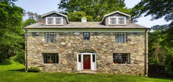 Stone Cottage This 1930's Lake Valhalla cottage was fully gutted to it's 18" thick walls made from surrounding field stone. The client asked to preserv