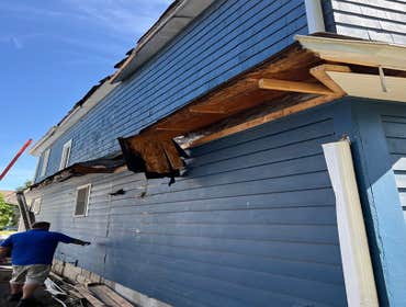 Photos by 614 Exteriors, LLC #8 Large tree landed on west side of house. We replace the roof, all the cedar siding and cedar shake on west side. We a