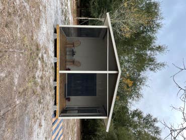Photos by Big Water Custom Homes & Realty Inc Insulated Panel Cabin with Screen Porch