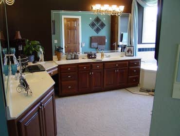 Satterly Project Complete bathroom remodel -- replaced cabinets, put in new tile to replace carpet, installed new four-jet shower, copper-clad sinks an