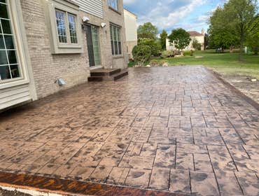 Photos by Guevara Alexander #1 A curated collection of our high-end residential concrete work, including stamped patios, exposed aggregate driveways, w