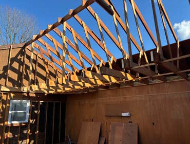 In-law suite addition project In-law suite addition above garage with kitchen, bathroom and bedroom to include large deck off the back of home and relo
