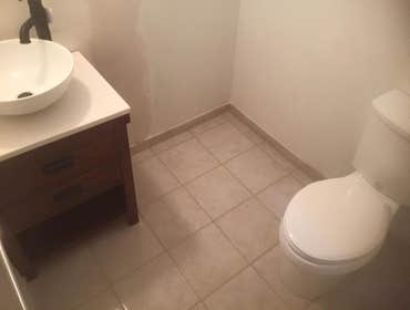 Photos by Coastal View Builder #2 Double bathroom remodel. Was also a deck repair and flooring job.