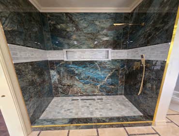 Photos by MC ALISTER TILE #1 5 showers total, was hired after another handyman did not water proof correctly, fixed all water proofing and installed 