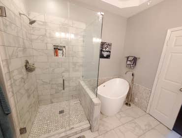 Photos by Trublue House Care of Allen #17 Full master bath remodeling. Freestanding tub, shower, panel glass, flooring, vanity, countertop, lighting, p