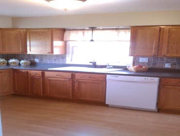 Olivet - Kitchen Remodel Oak-faced cabinets, High-Def laminate counter tops and Oil-rubbed Bronze fixtures and hardware create a warm, inviting space. 