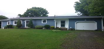 Kingston - Full Exterior All new Siding, Capped Windows, Exterior Sheeting, Soffit and Fascia. Also rebuilt rear porch to have an overhang to eliminate