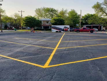 Pavement sealcoating, asphalt overlay. Whatever parking lot maintenance your company needs, we're here to help!