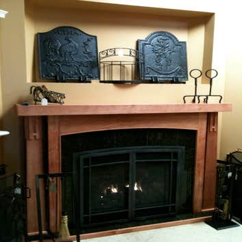 Traditional Gas Fireplace Vignette Minnetonka direct vent gas fireplace by Kozy Heat; shown with Arched Prairie design doors in Titanium finish, Crafts