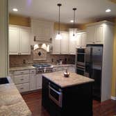 Kitchen remodel Complete renovation removal of load bearing wall add a new support beam to expand this massive kitchen . Designed for entertainment an